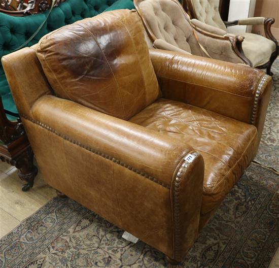A large brown leather armchair